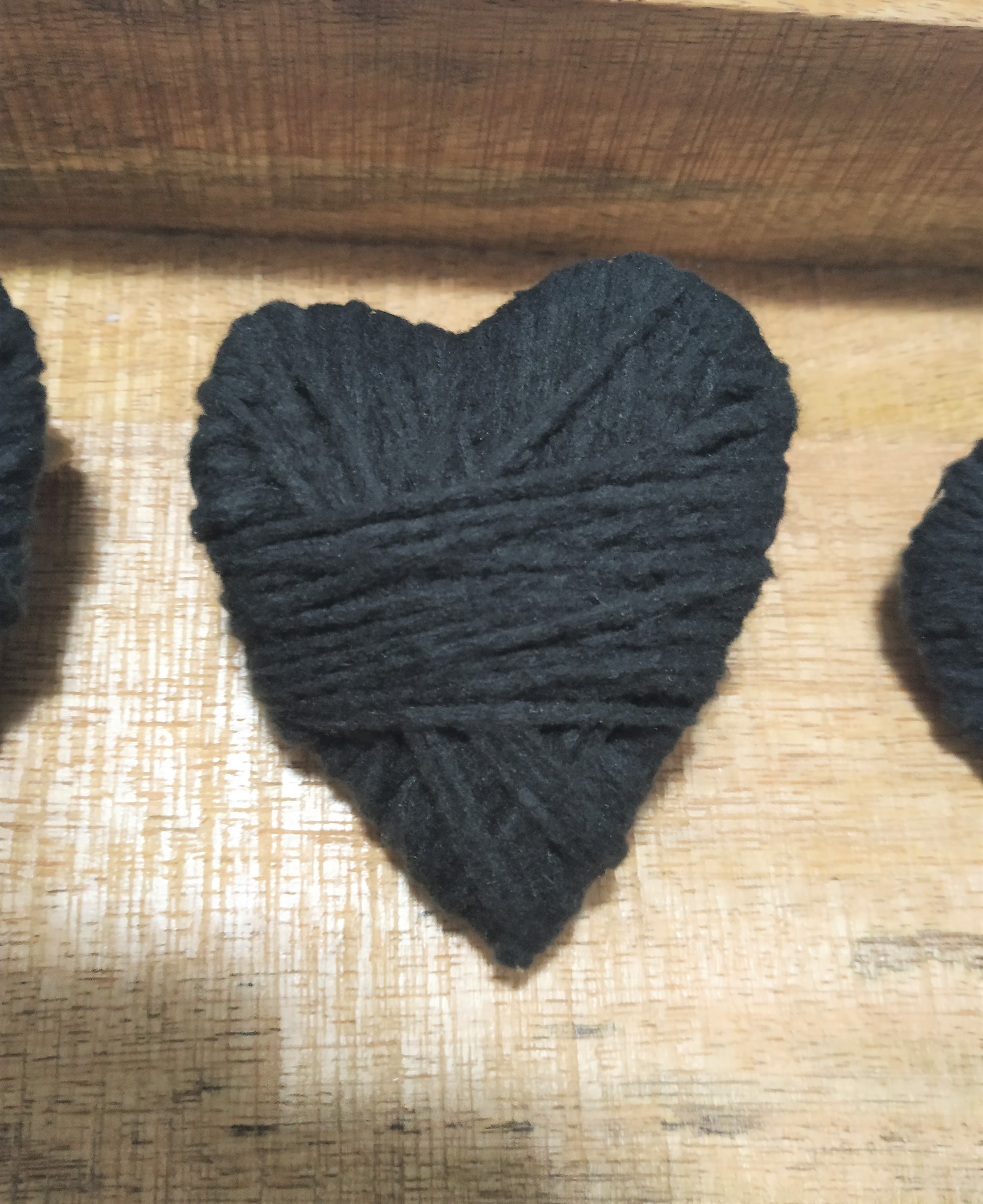 Black yarn wrapped heart.