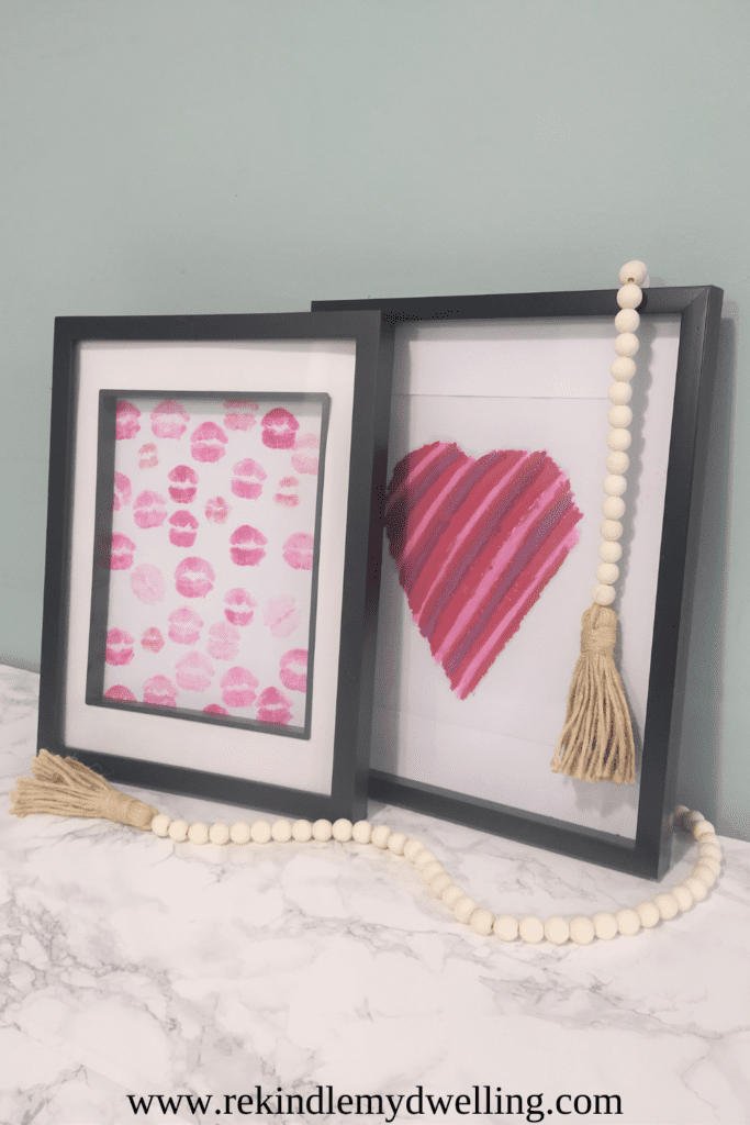 Easy lipstick art framed heart and kisses with a bead decoration.