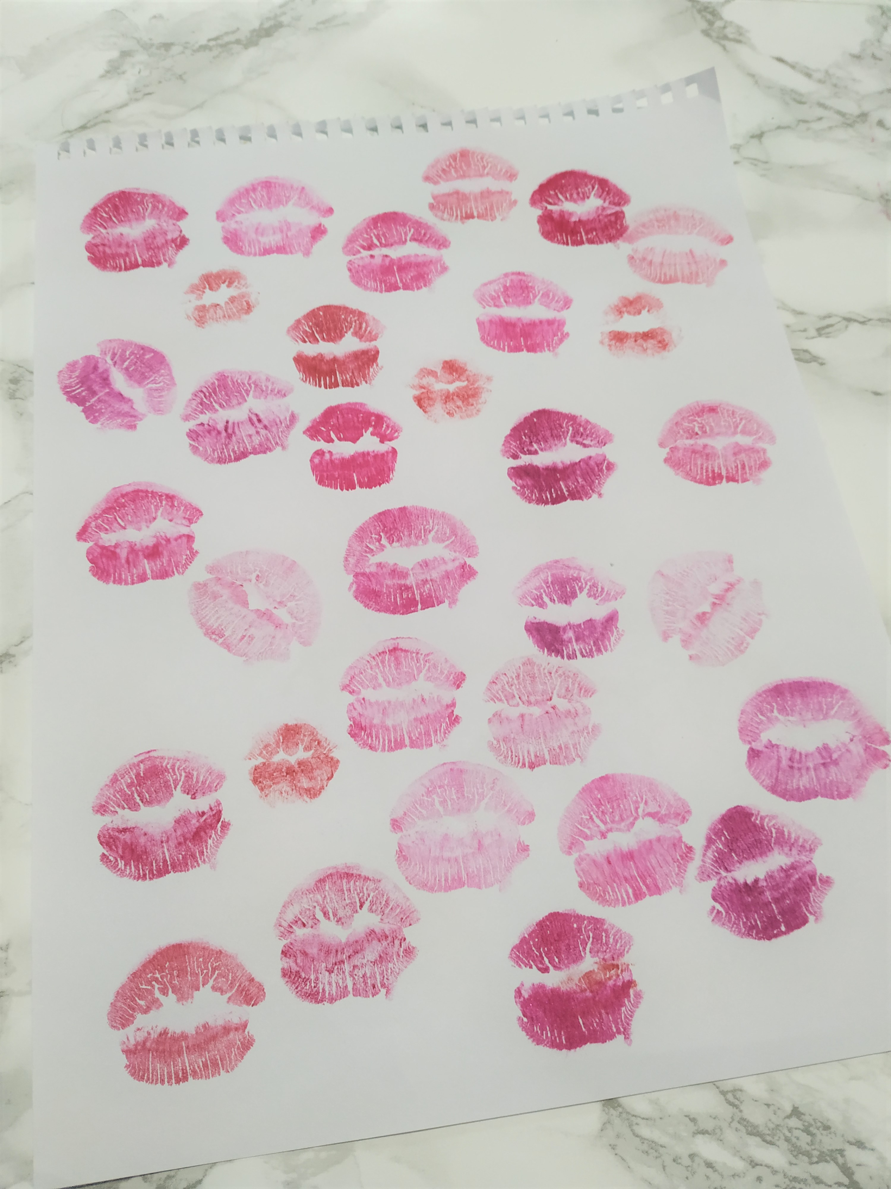 Paper filled with lipstick kisses.