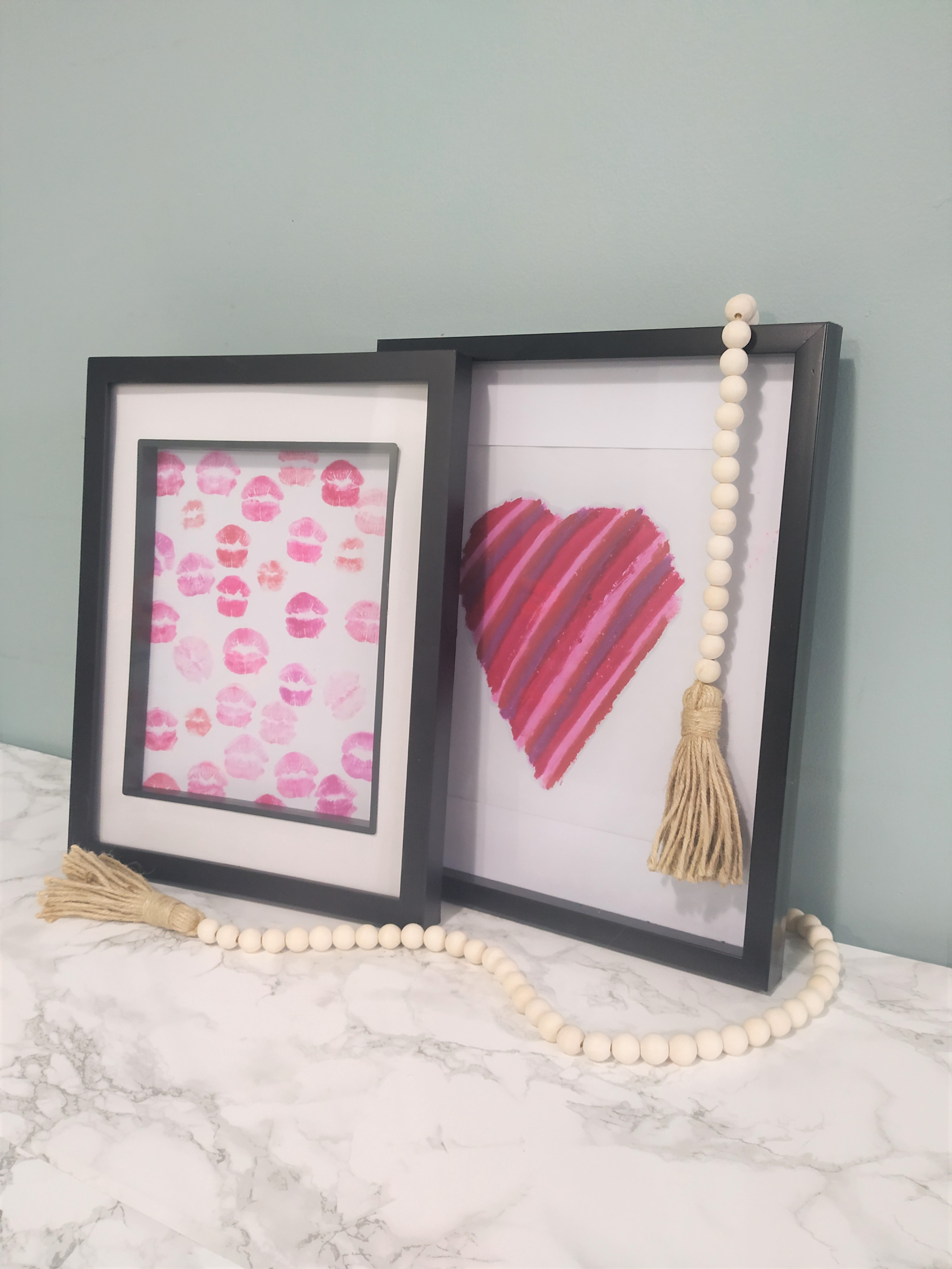 Easy lipstick art framed heart and kisses with a bead decoration.