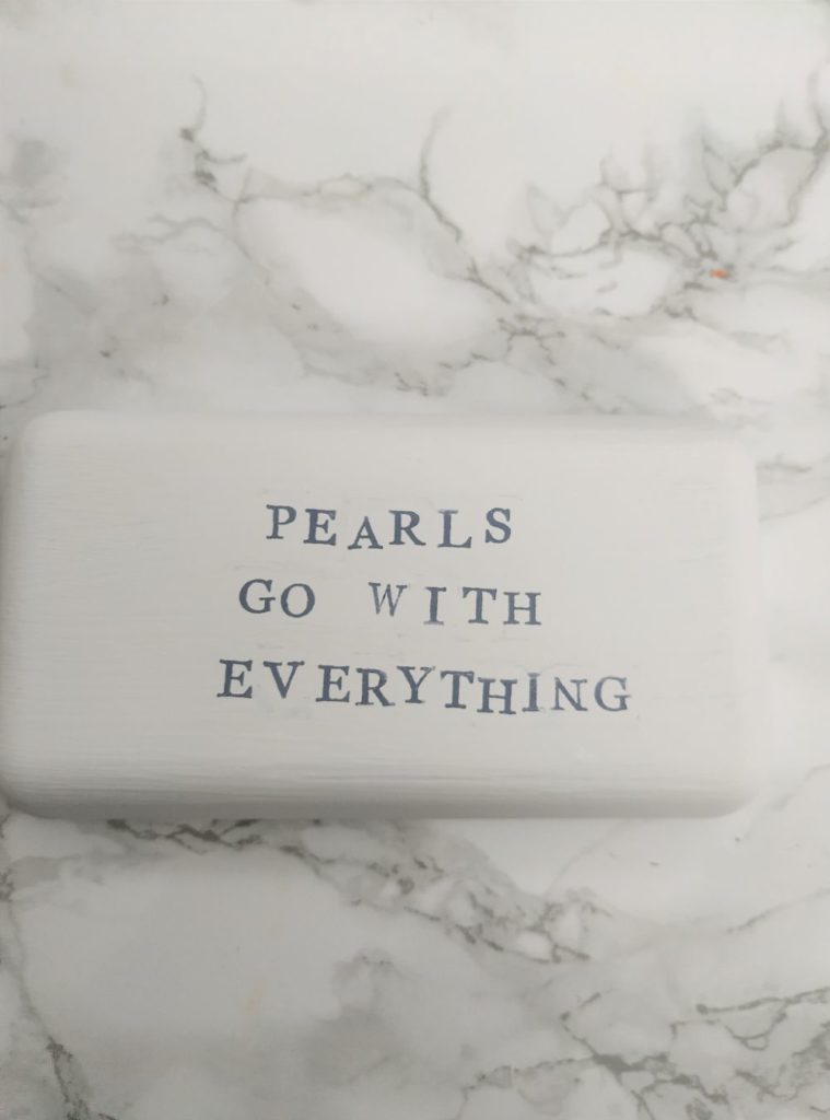 Stamped "pearls go with everything."