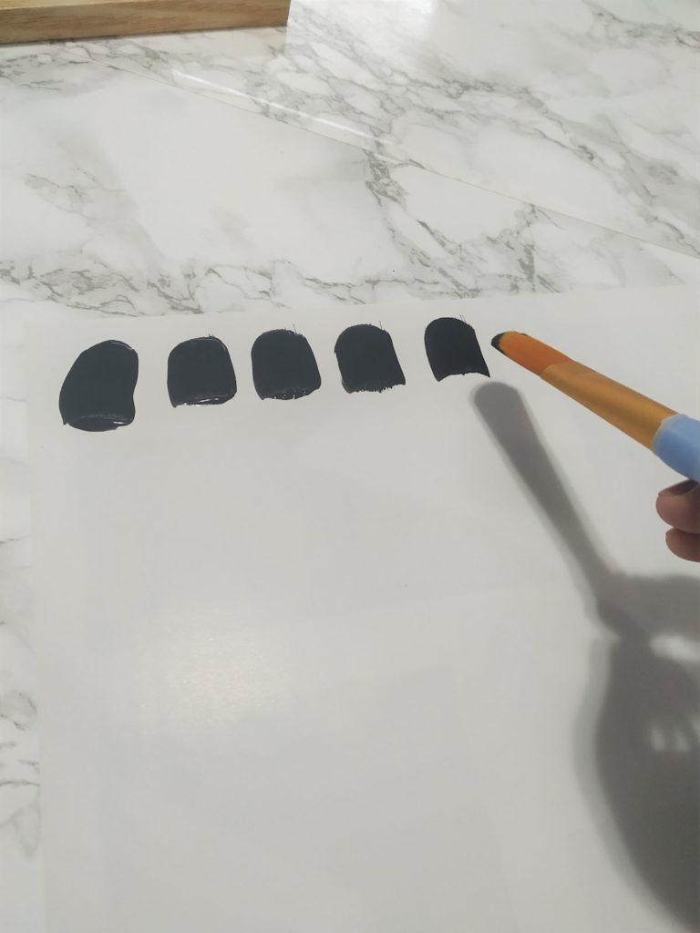 A row of black brushstrokes.