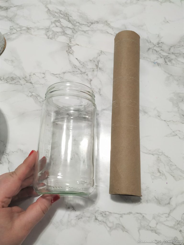 Empty mason jar and cardboard tube.