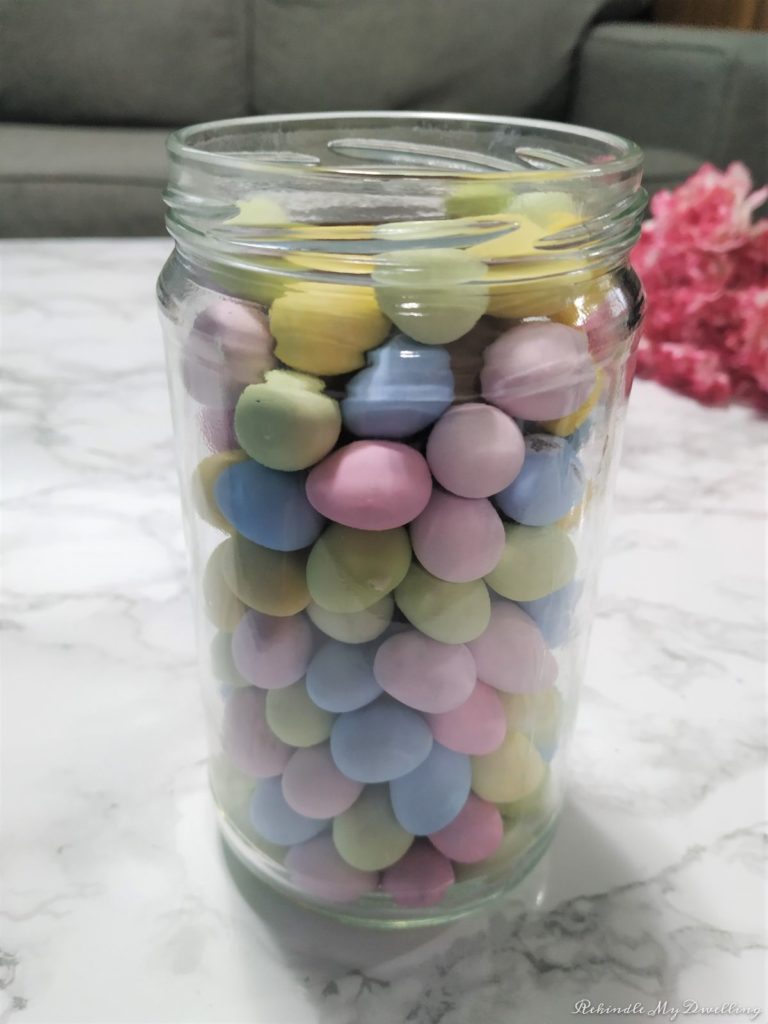 Mason jar filled with chocolate eggs.