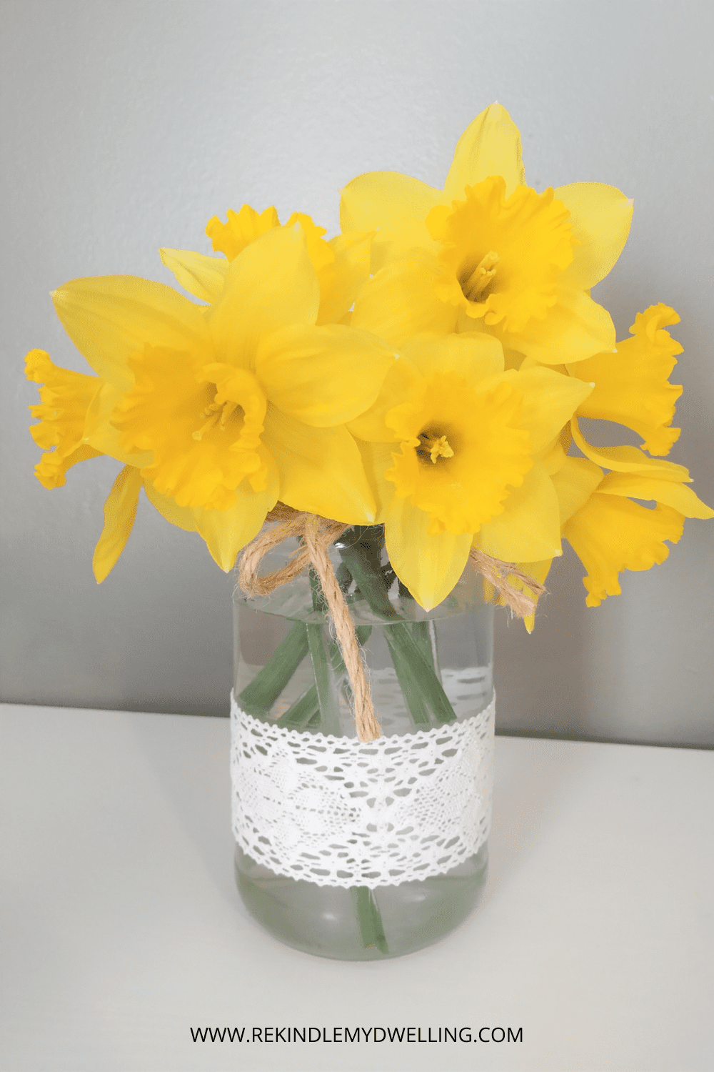 Daffodils in a spring vase with lace.