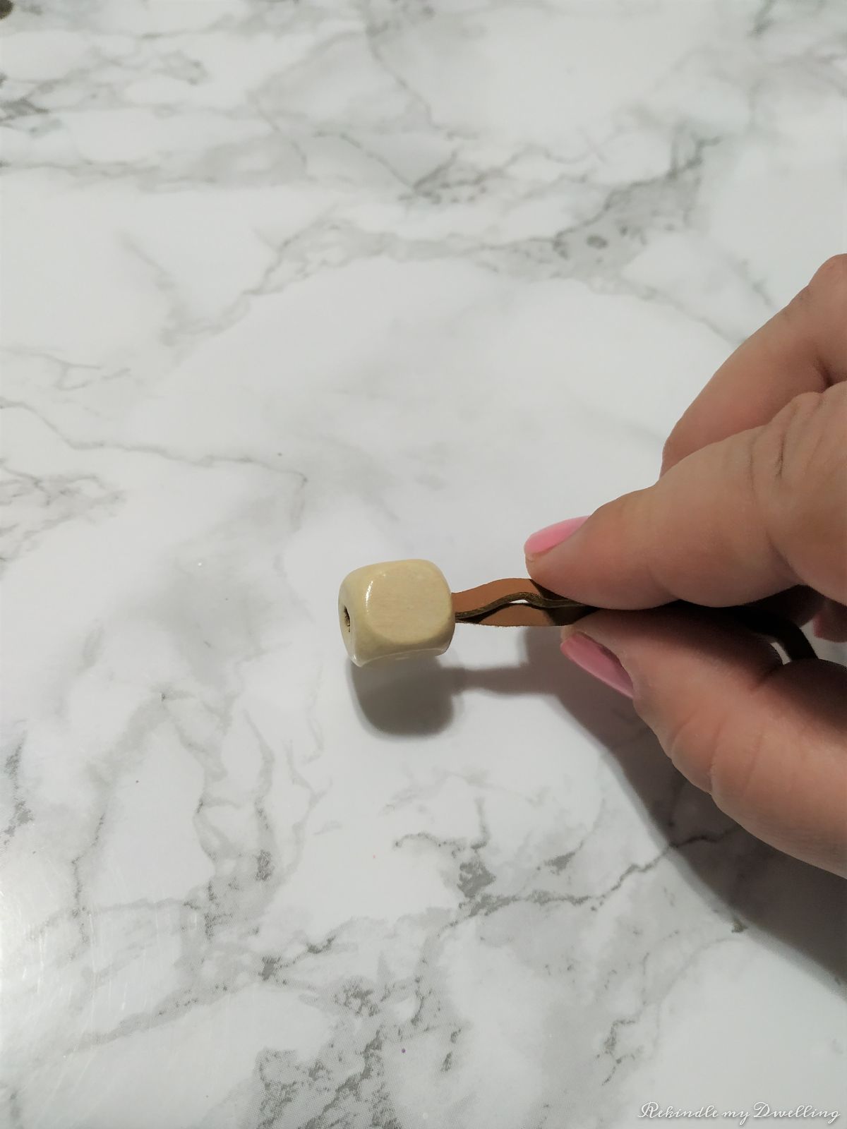stringing on wood  beads.