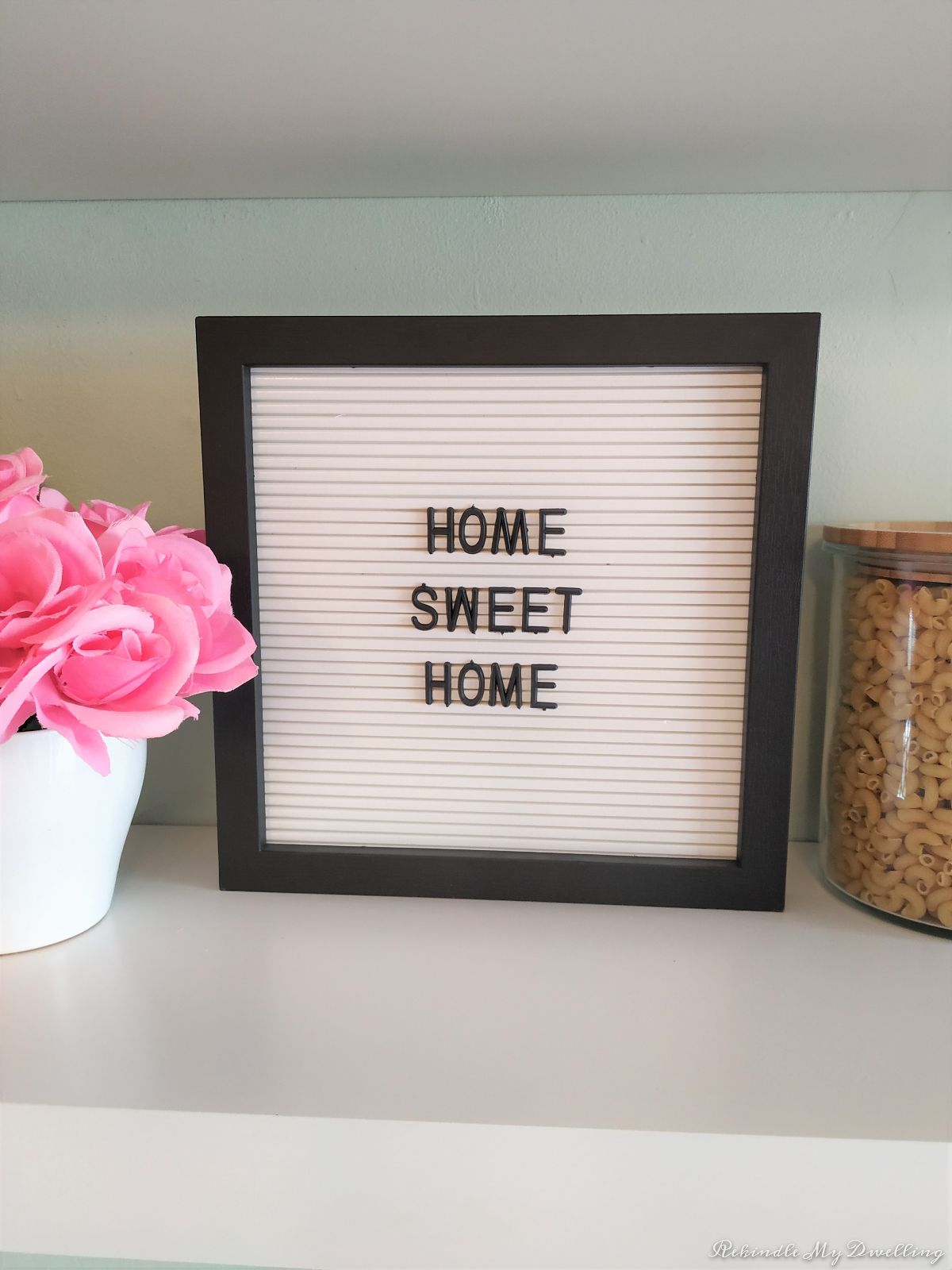 Small sign with Home Sweet Home written on it.