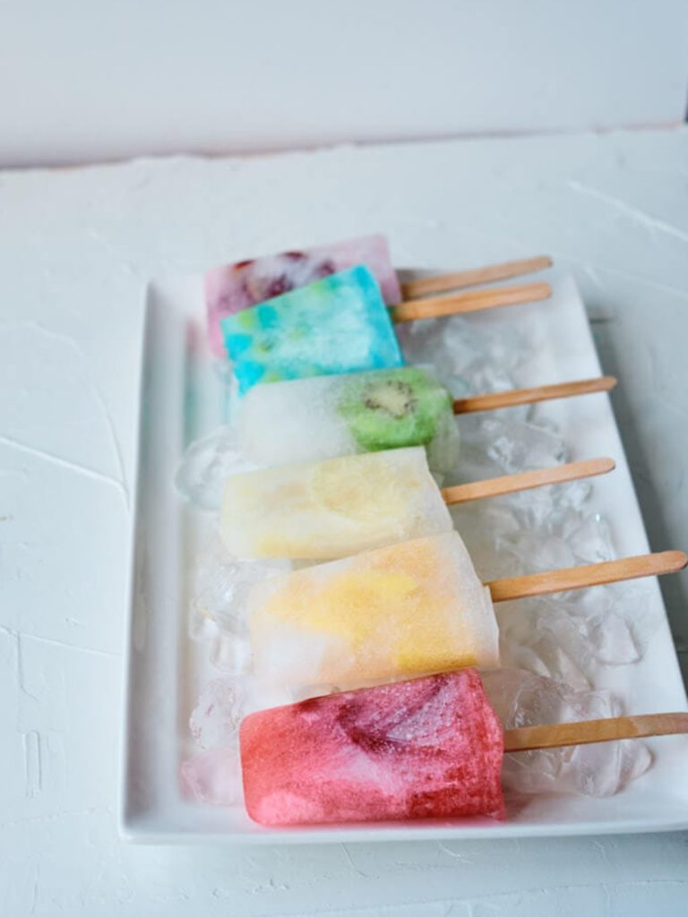 Rainbow colored summer popsicles.