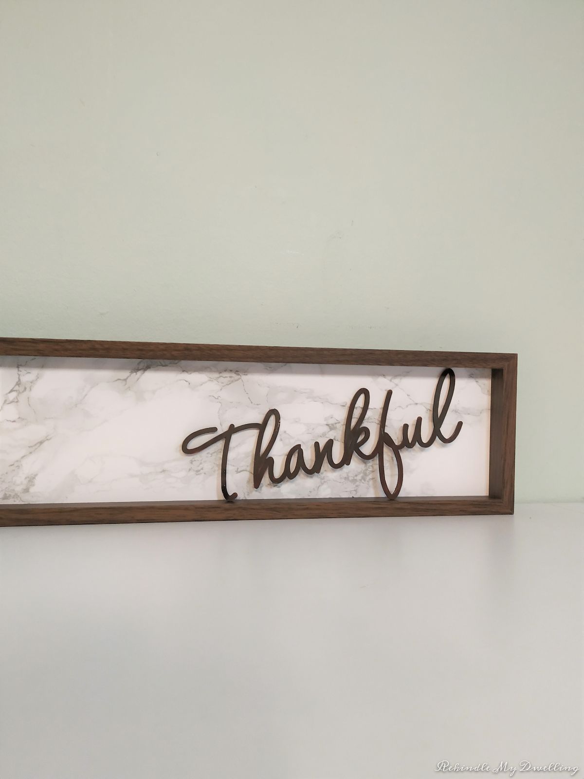 DIY thankful wood sign attaching the lettering.