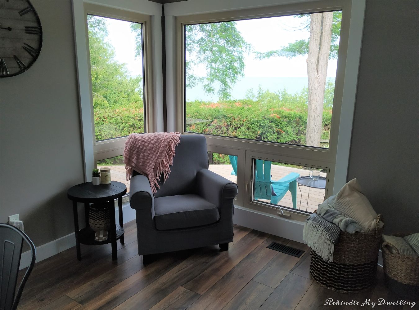 Cottage makeover showing finished corner nook with chair and table.