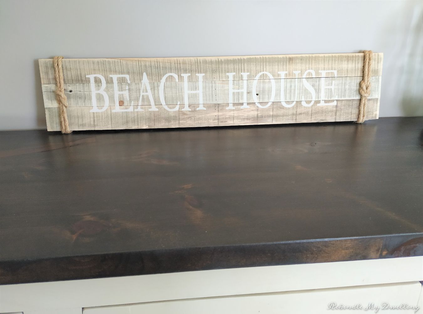 Beach house wooden sign.