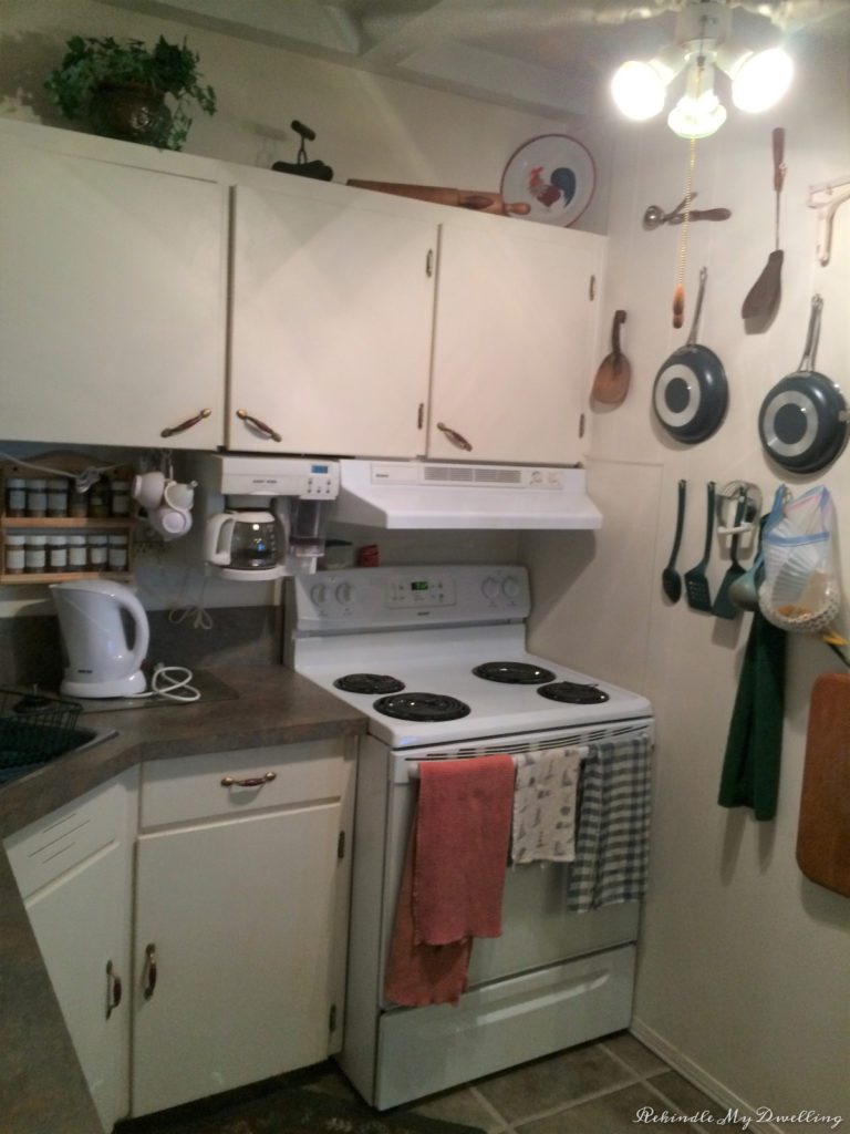 Kitchen showing stove, decor and pots.