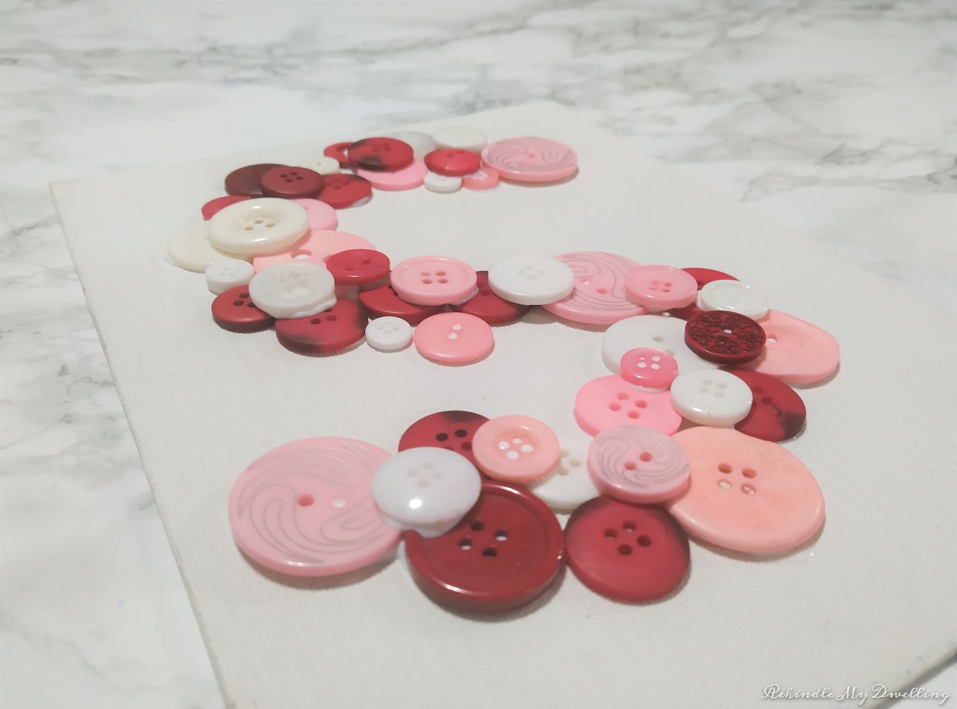 Angled view of Pink buttons.