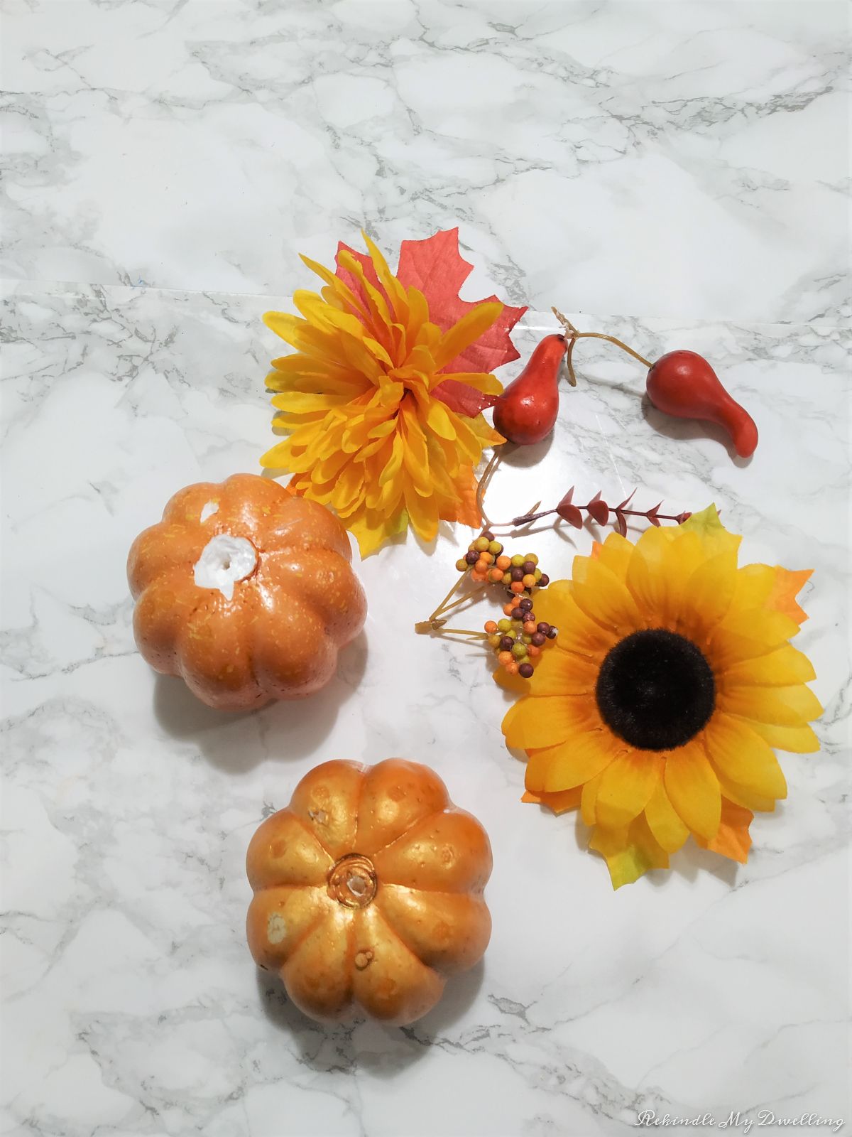 Foam pumpkins with faux flowers removed.