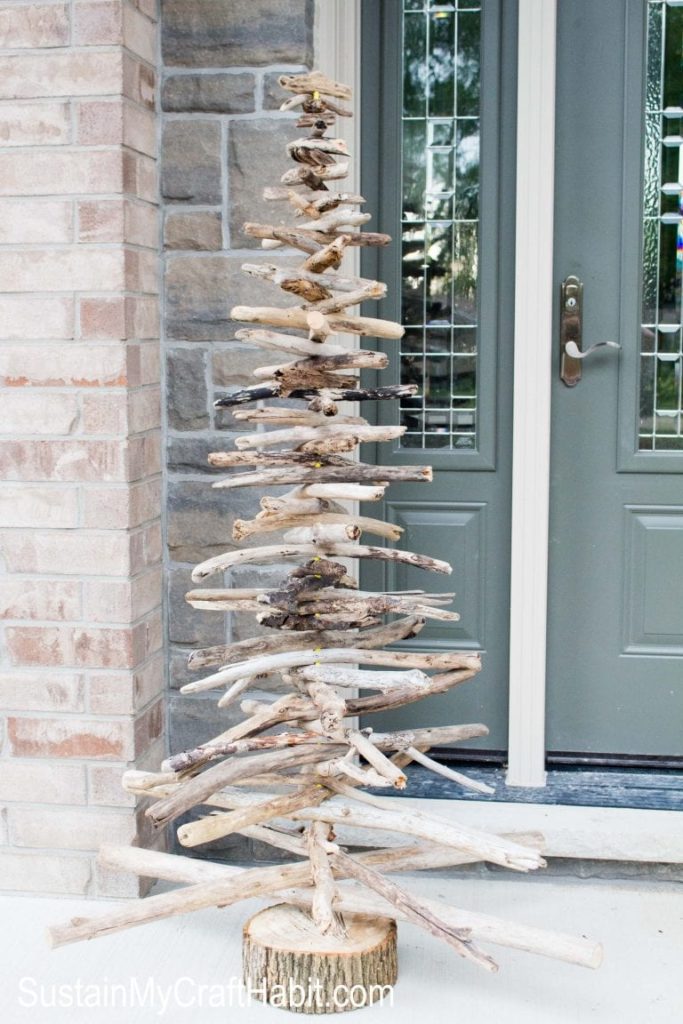 Driftwood Christmas tree on a porch.