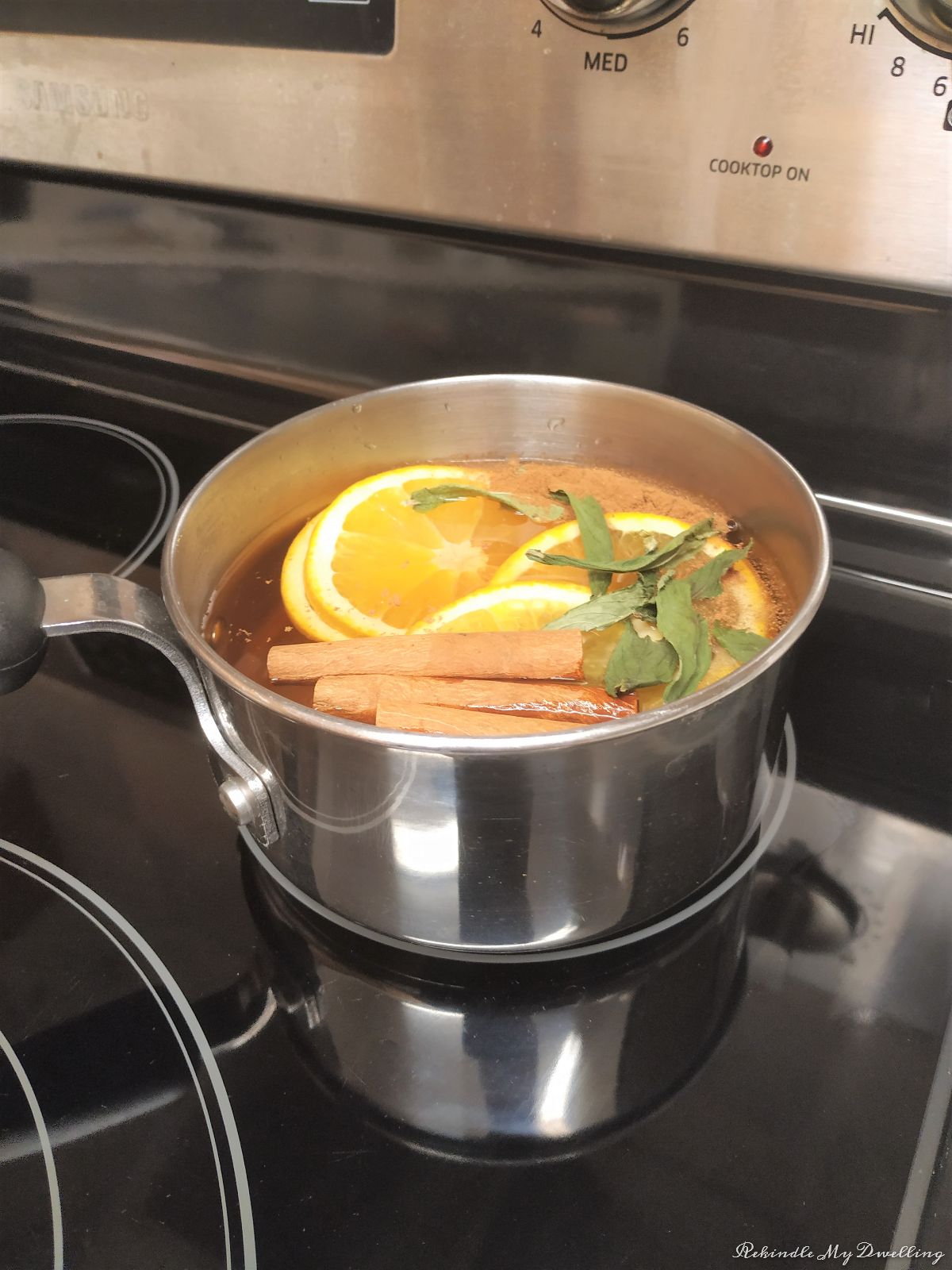 Adding the pot on the stove top.