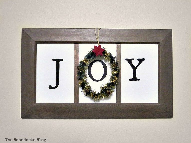 Wooden sign with the word "joy".