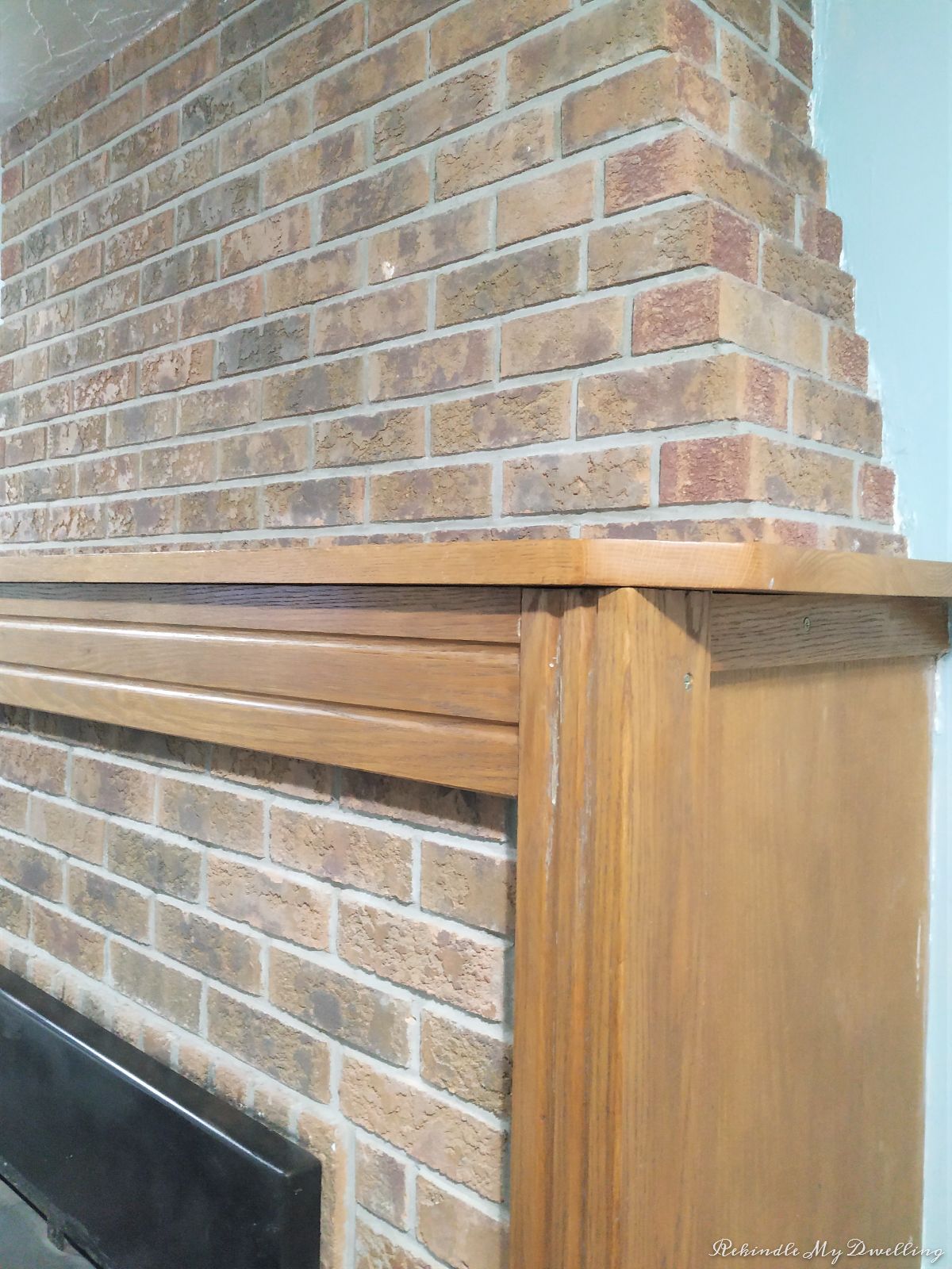 Side angle of a brick fireplace.