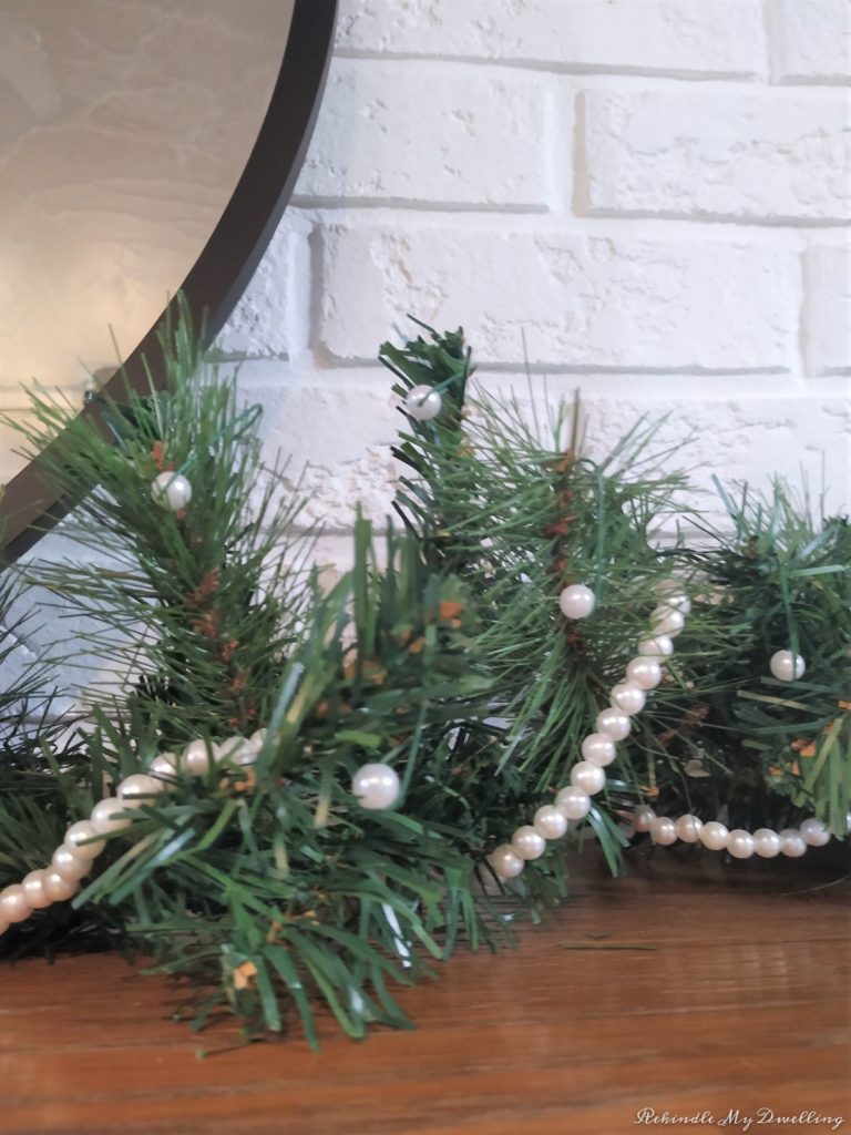 Pine garland wrapped with pearls.