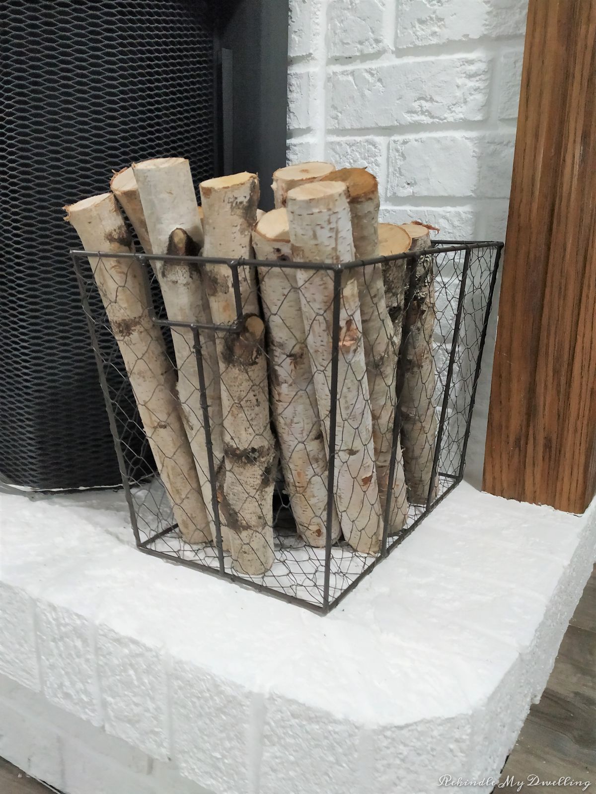 Birch wood in a wired basket.