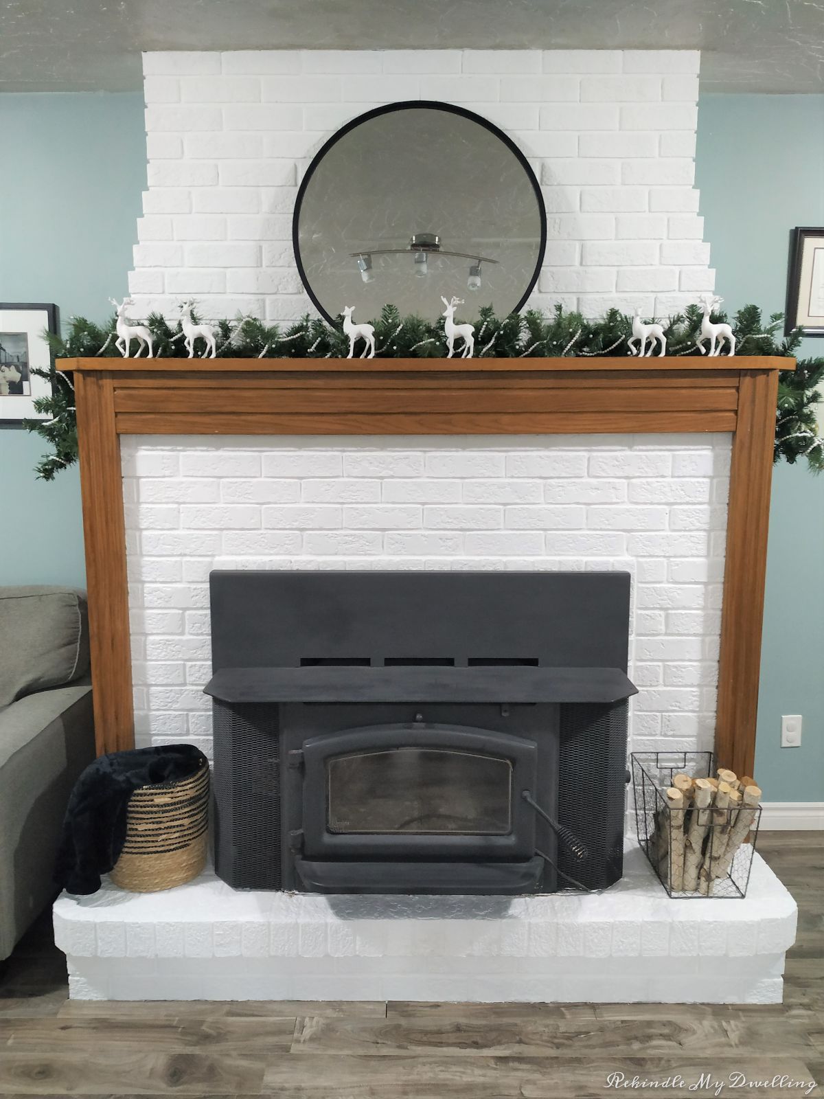 Fireplace mantel decorated for Christmas.