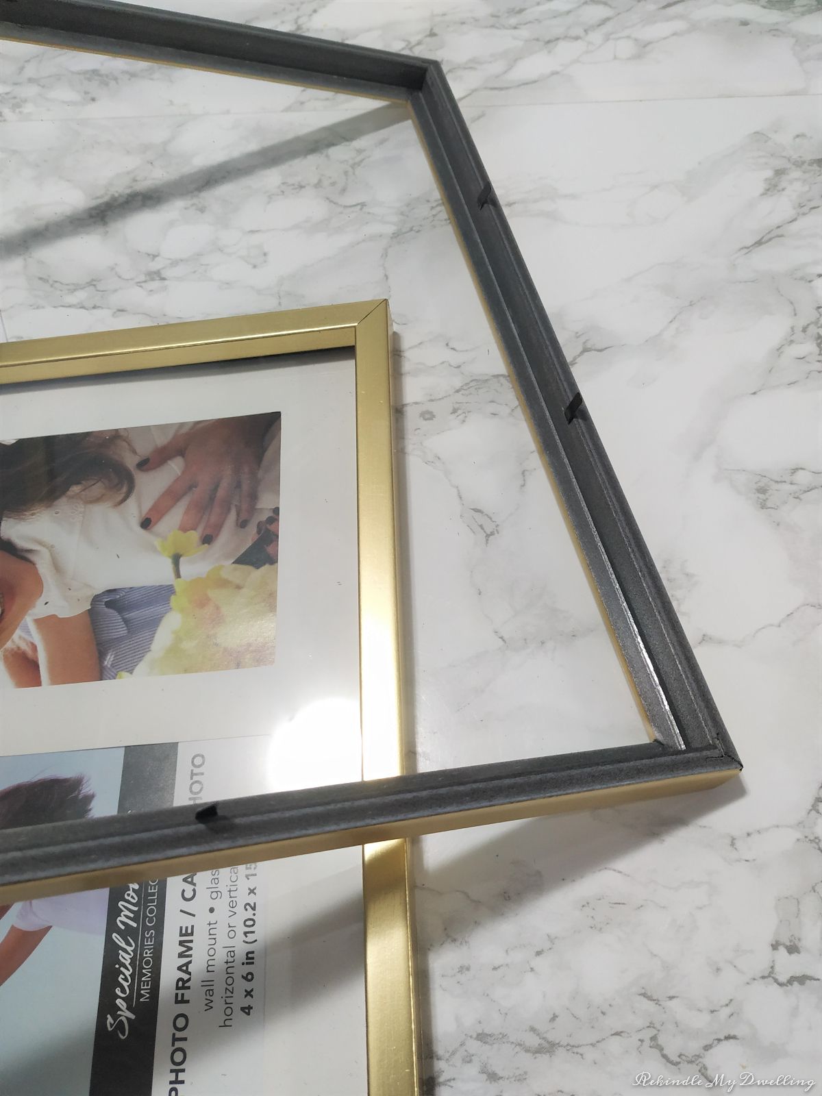 Removing the backing and glass from the picture frame.