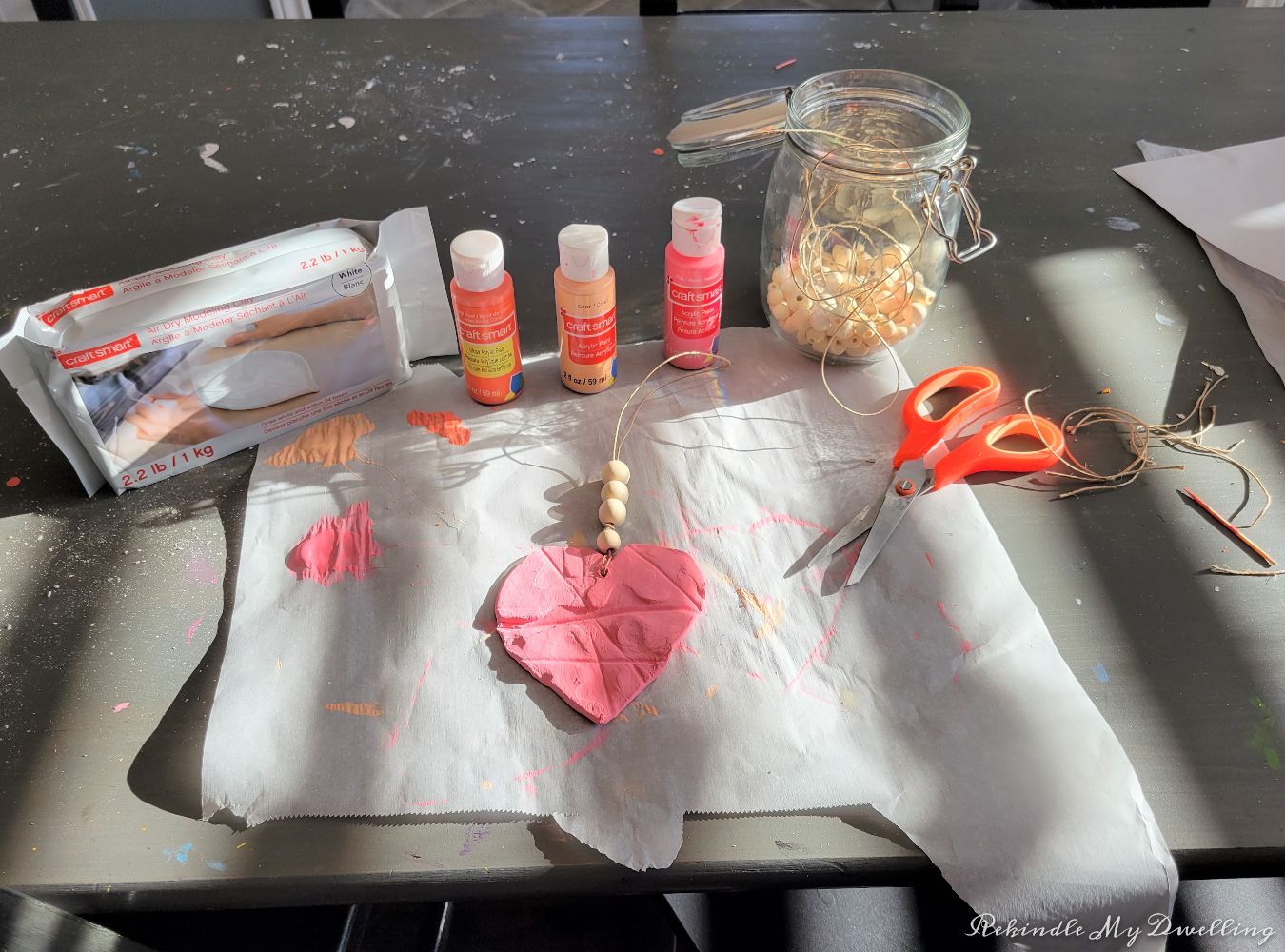 Painting and decorating air clay hearts.