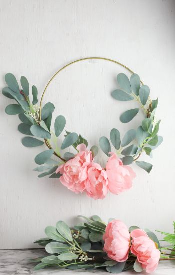 Spring decor crafts for adults with a hoop wreath with flowers.