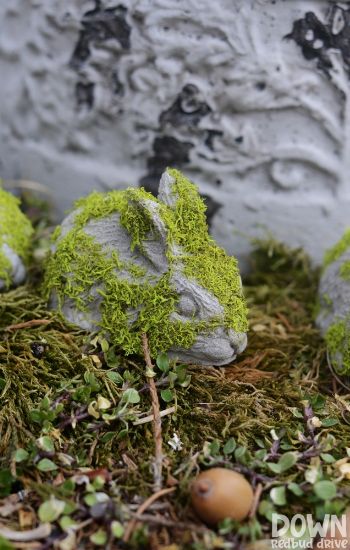 Concrete bunny in a garden.