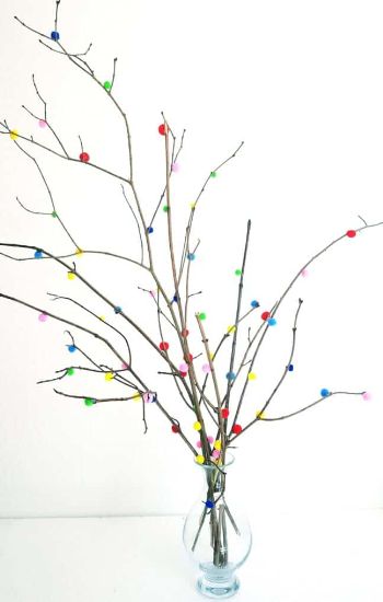 Spring decor crafts for adults with a pom pom tree in a vase.