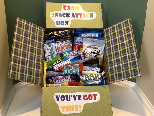 Gift box filled with candy and snacks.