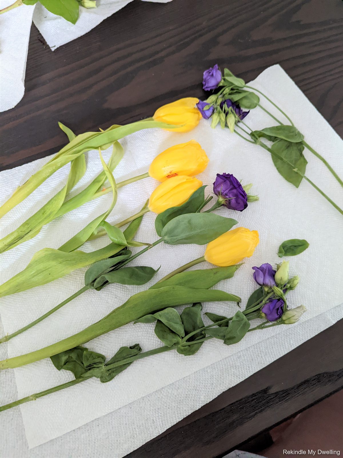 Laying flowers on a paper towel.