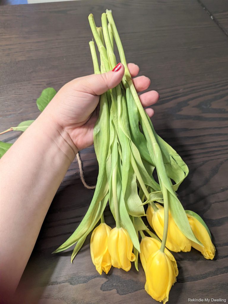 Holding a bunch of flowers together.