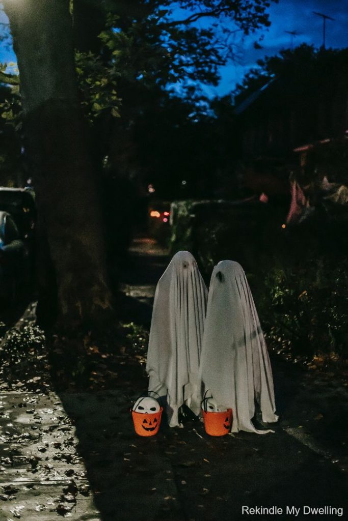 Kids dressed up as ghosts.