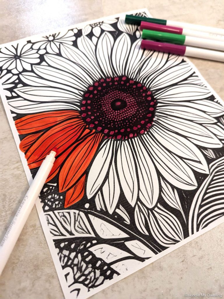 Sunflower coloring page with markers.