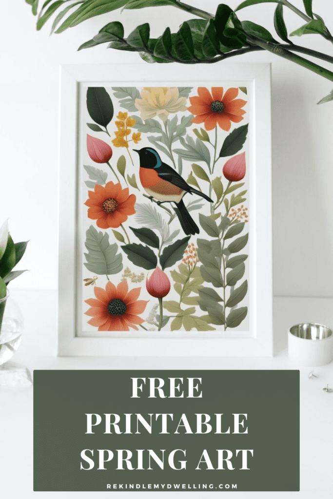 free printable spring art in a frame among plants and decor with text overlay.