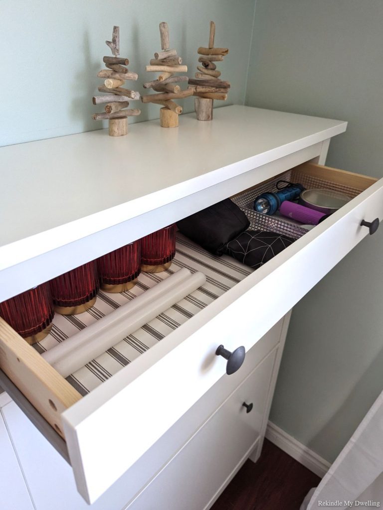 Open drawer with candles.
