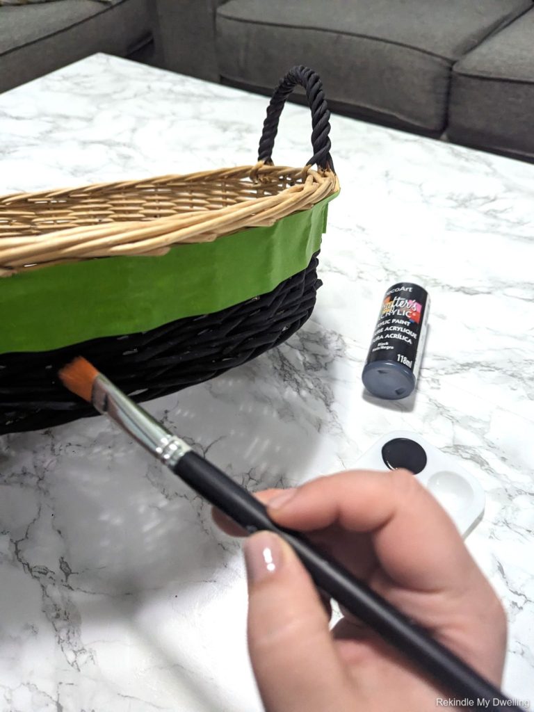 Painting a wicker basket.